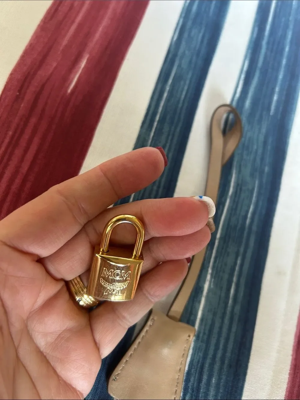 MCM jet and lock gold color with cream lanyard amazing condition